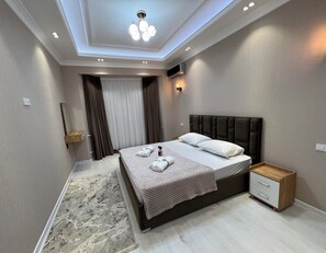 Family Quadruple Room, Balcony, Garden View | Desk, iron/ironing board, free WiFi, bed sheets - Baurum Family Apartments (Tashkent)