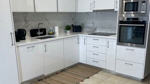 Deluxe Apartment, Balcony, Sea View | Private kitchen - Helena Beach Apartment (Limassol)