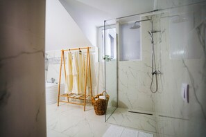 Shower, hair dryer, towels, soap