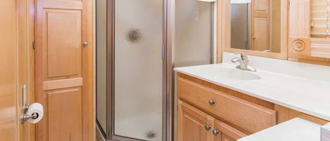 Shower, towels, soap, toilet paper