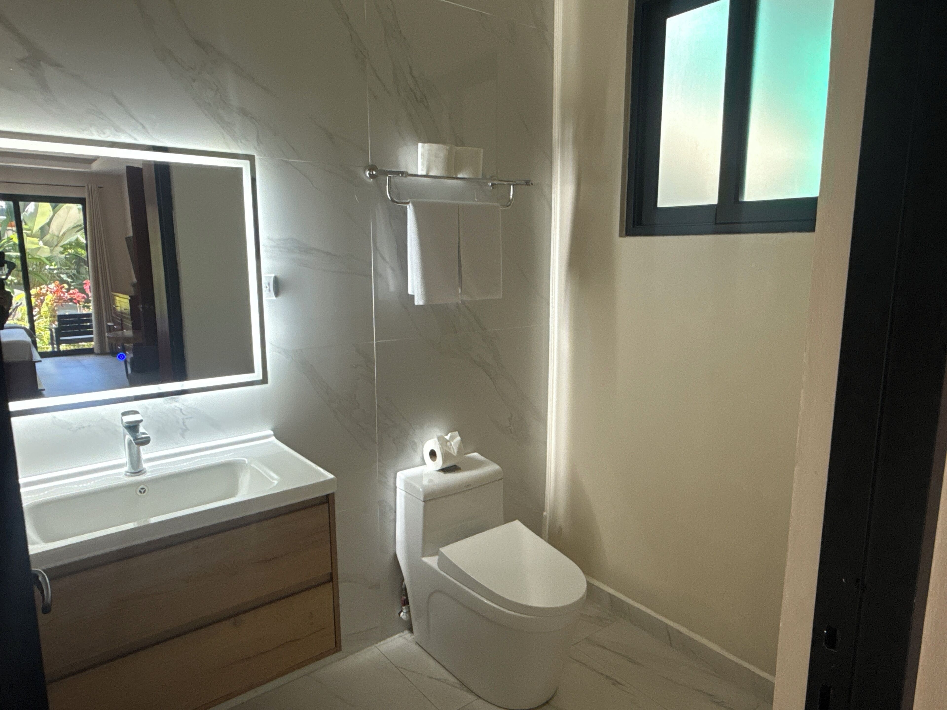 Shower, towels, soap, toilet paper