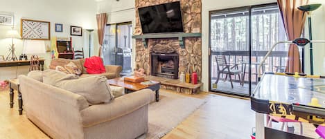 TV, fireplace, books