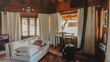 Deluxe Cabin, Kitchen | Living area | 32-inch TV with digital channels, Netflix, pay movies