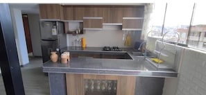 Fridge, dishwasher, electric kettle, cookware/dishes/utensils