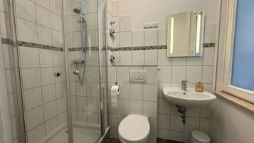 Shower, towels, soap, toilet paper