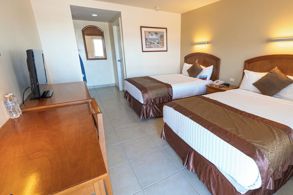 Economy Room, 2 Queen Beds, Non Smoking | In-room safe, desk, laptop workspace, soundproofing
