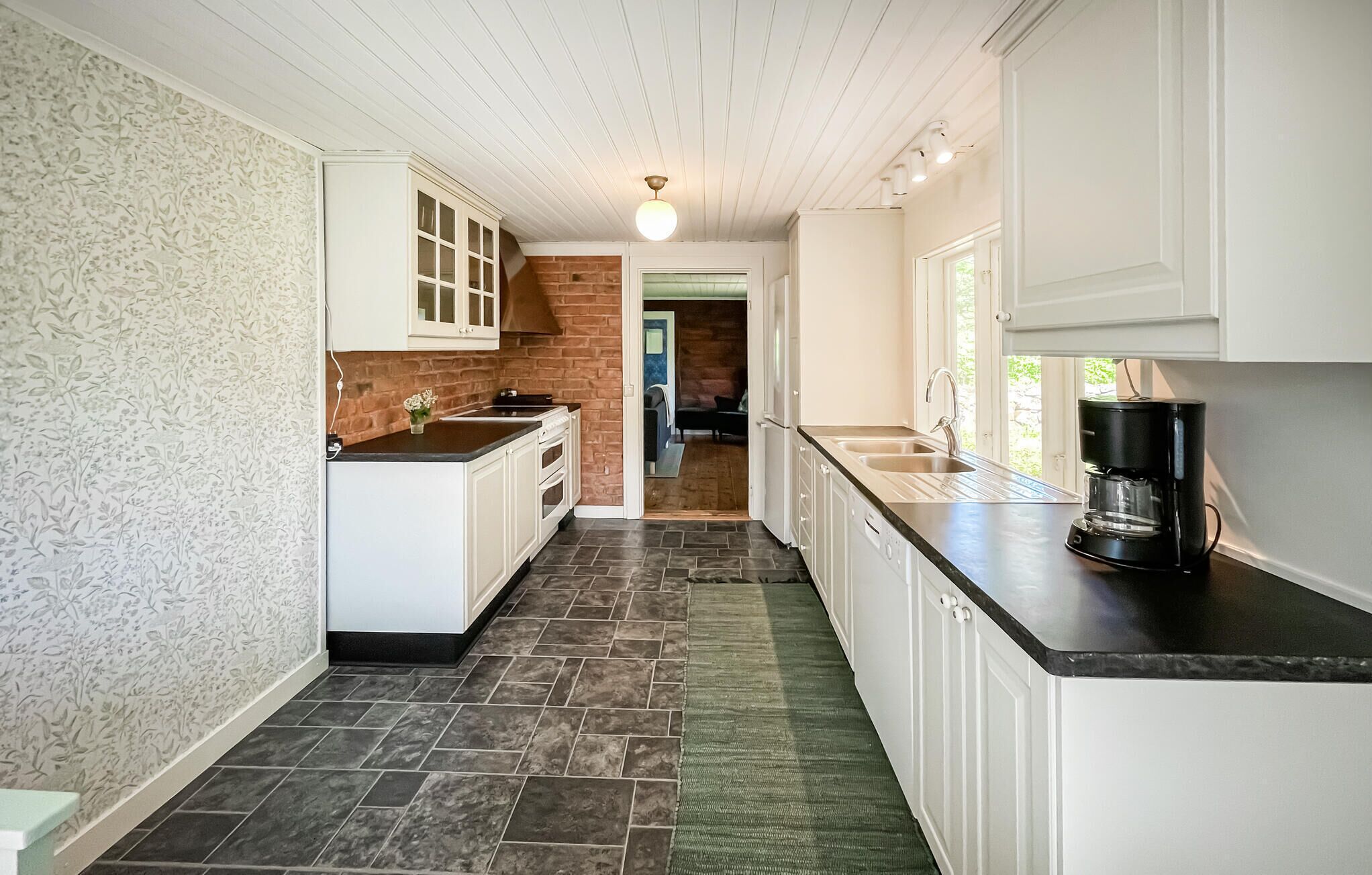 Fridge, stovetop, dishwasher, coffee/tea maker