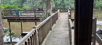 Two-story on the river that sleeps up to 14!  Boat lift & ramp. Deck over water