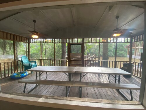 Two Story House with deck over the river