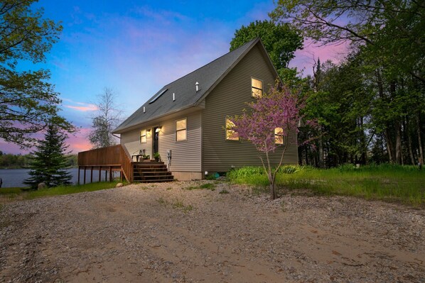 A house with a sloped roof, a front porch, and a small porch area.