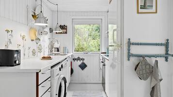 Fridge, stovetop, dishwasher, coffee/tea maker