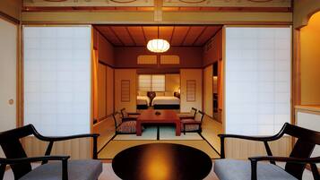 A traditional Japanese room with tatami flooring, a low wooden table, and shoji screens.