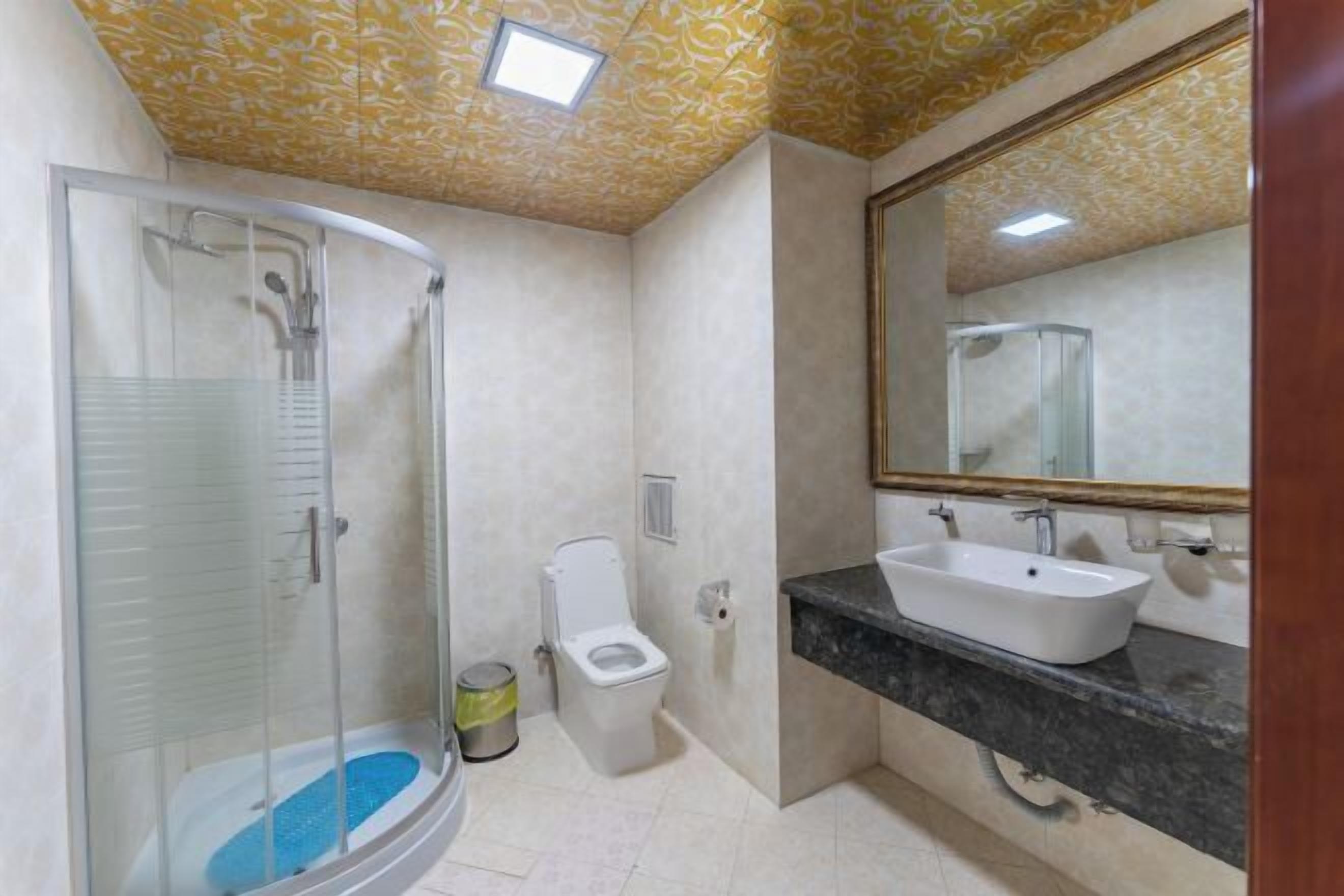 Bathroom | Shower, rainfall showerhead, designer toiletries, hair dryer