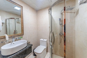 A bathroom with a sink, toilet, and shower. - Amar Hotel Ulaanbaatar live  (Ulaanbaatar)