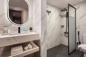 Standard Single Room | Bathroom | Hair dryer, slippers, towels, soap - Regency Inn (Muscat)