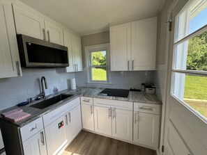 Fridge, microwave, stovetop, coffee/tea maker