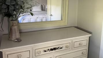 1 bedroom, desk, iron/ironing board, travel crib