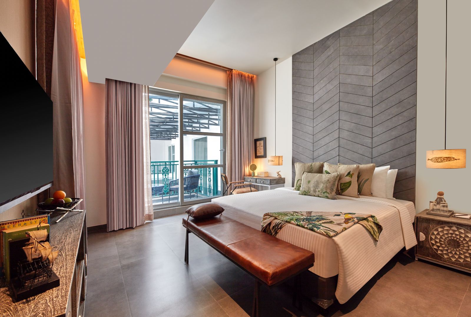 A hotel room with a large bed, a bench, a TV, a balcony with a view, and a modern wall design.