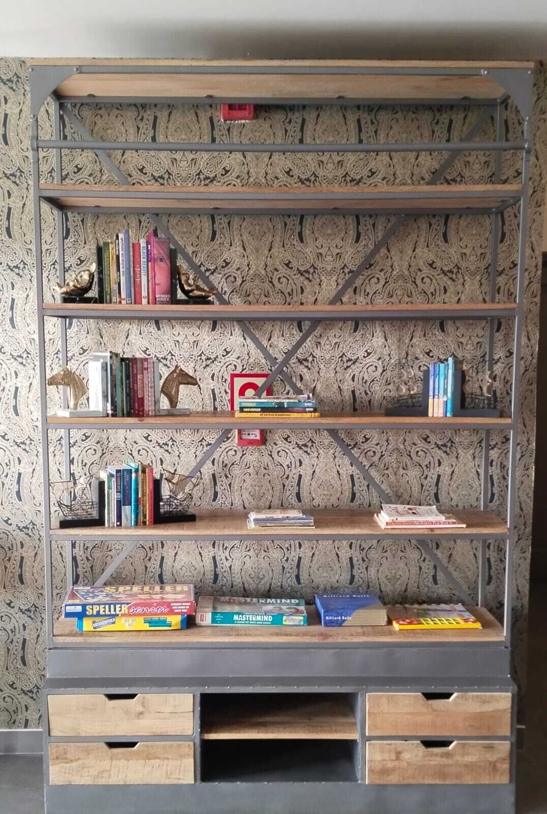 A bookshelf with multiple shelves, some books, and decorative items.