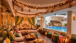 A luxurious indoor setting with a pool, comfortable seating, and decorative lighting. - Fortune Park Palampur - Member ITC Hotels' Group (Palampur)