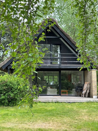 Cozy thatched cottage with modern décor