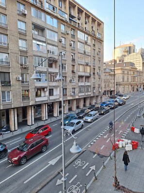 Residents enjoy air-conditioned comfort in this urban building with balconies.