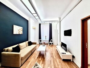 Apartment | Living area | 81-cm Smart TV with satellite channels, offices - Victoriei Old Town Apartment (Bucharest)