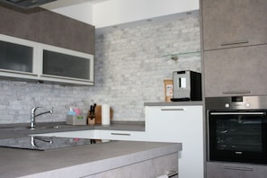 Fridge, oven, stovetop, dining tables