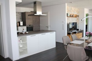 Fridge, oven, stovetop, dining tables