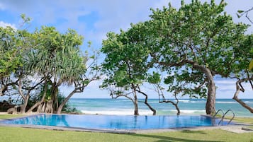 Outdoor pool, pool umbrellas, pool loungers