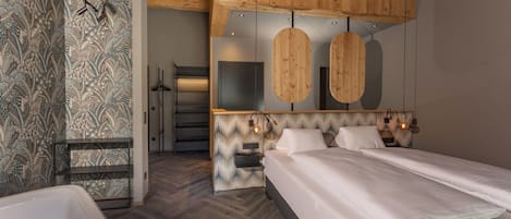 A modern bedroom with a large bed, a built-in bench, and a wooden ceiling.