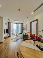 Deluxe Apartment, 2 Bedrooms, Balcony, City View, High Floor (15th floor above) | Living area | 60-inch Smart TV with cable channels, pay movies
