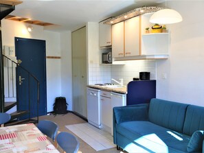 Cozy living space with a kitchenette, dining area, and comfortable seating.