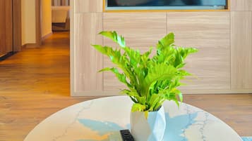 Family Suite, Balcony, Ocean View | Living area | 50-inch Smart TV with cable channels
