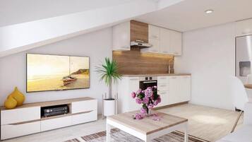 Departamento (Two Bedroom Apartment C2) | Sala de estar | Televisión de pantalla plana de 32 pulgadas con canales digitales