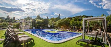 Seasonal outdoor pool, pool umbrellas, pool loungers