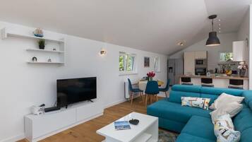 Apartment (Three Bedroom Apartment with Balcony) | Living room | 32-inch flat-screen TV with digital channels