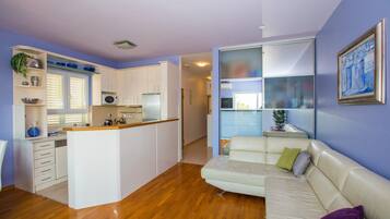 Apartment (Two Bedroom Apartment with Balcony an) | Living room | 32-inch flat-screen TV with digital channels