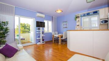 Apartment (Two Bedroom Apartment with Balcony an) | Living room | 32-inch flat-screen TV with digital channels