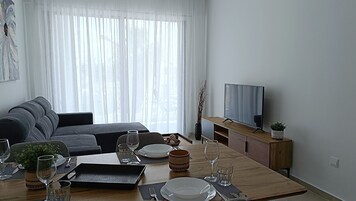 Luxury Apartment, 1 Bedroom | Living area | 42-inch Smart TV with digital channels