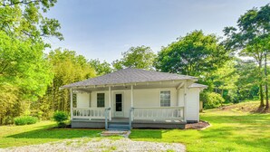 A single-story house with a porch, surrounded by a well-maintained lawn and trees. - Seneca Vacation Rental w/ Grill Near Lake Hartwell (Seneca)
