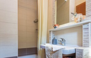 Shower, hair dryer, towels, toilet paper