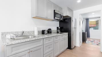 Fridge, microwave, stovetop, coffee/tea maker