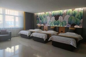 A hotel room with three beds, a sofa, and a large window with curtains. - Jinding Impression Theme Hotel, Chenbar Tiger Banner (Old Barag Banner)