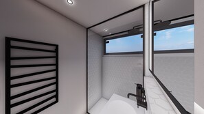 A modern bathroom with a large window, a shower area, and a toilet.