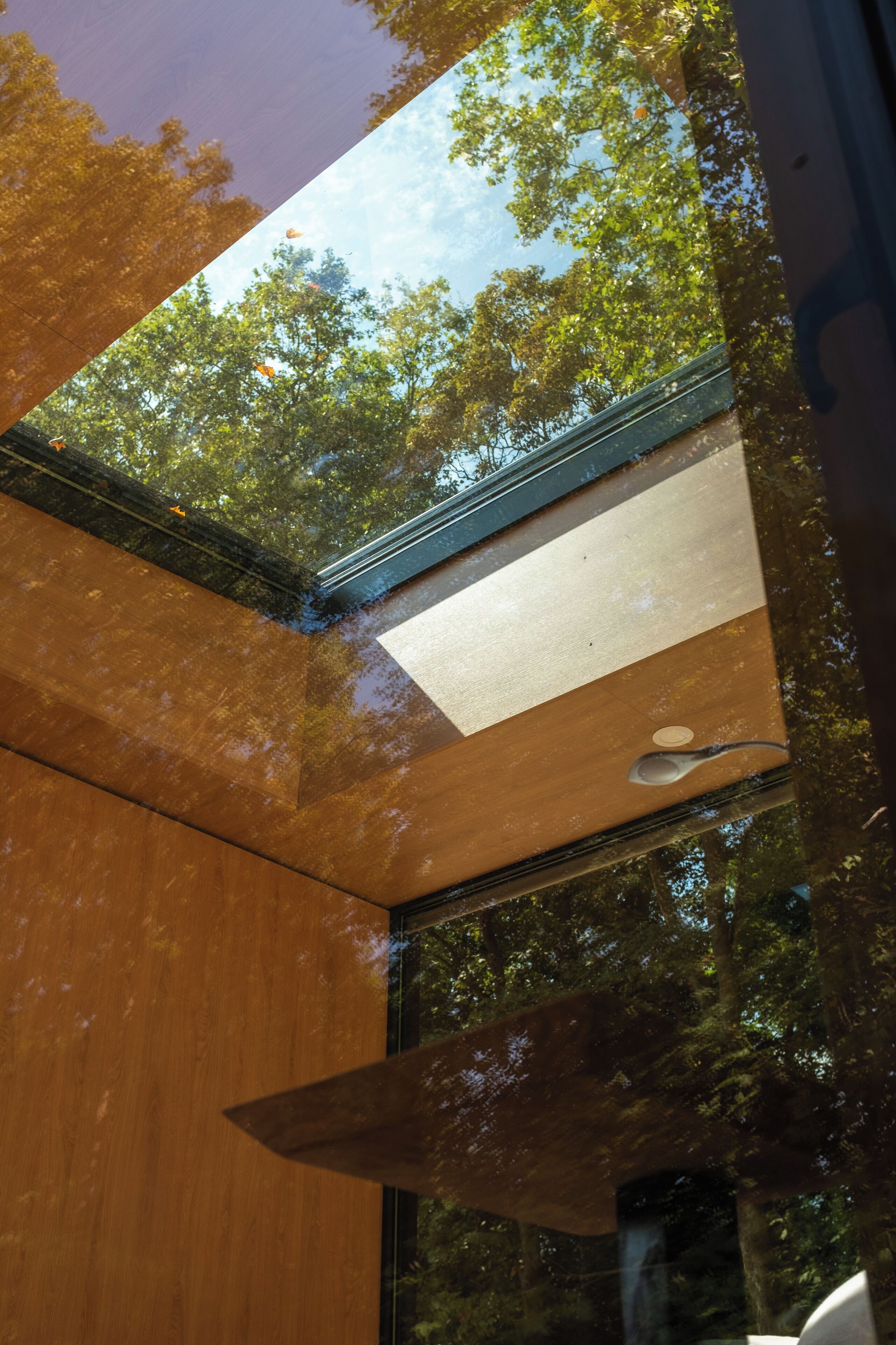 A modern building with a large skylight allowing natural light to enter.