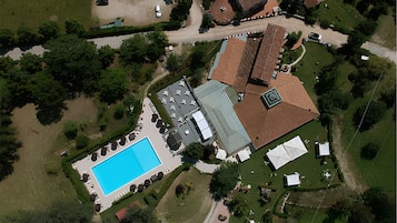 Seasonal outdoor pool, open 10:00 AM to 6:00 PM, pool umbrellas