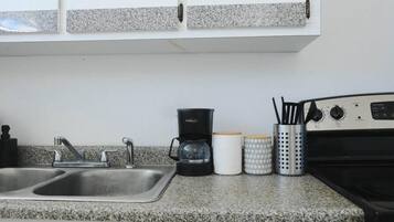 Coffee/tea maker, fridge, microwave, oven