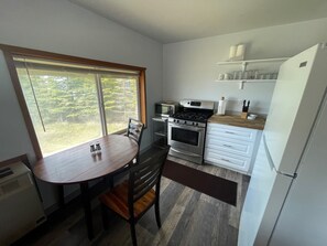 Fridge, microwave, oven, stovetop - Kenai Beachfront Cabin 1 - In the middle of river fishing on the beach. (Kenai)