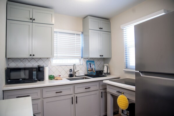 Fridge, microwave, stovetop, coffee/tea maker
